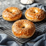 High Protein Cottage Cheese Bagels Recipe That’s Easy & Delicious 9 Four cooled high protein cottage cheese bagels on a rack