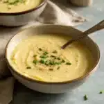 Cream of Potato & Leek Soup in rustic bowl