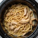 Slow Cooker Chicken Parmesan Pasta served in a rustic bowl