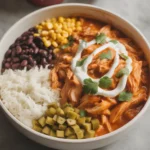 Slow Cooker Chicken Burrito Bowls served with toppings.
