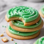 Soft Christmas Sugar Cookies on a plate with holiday lights