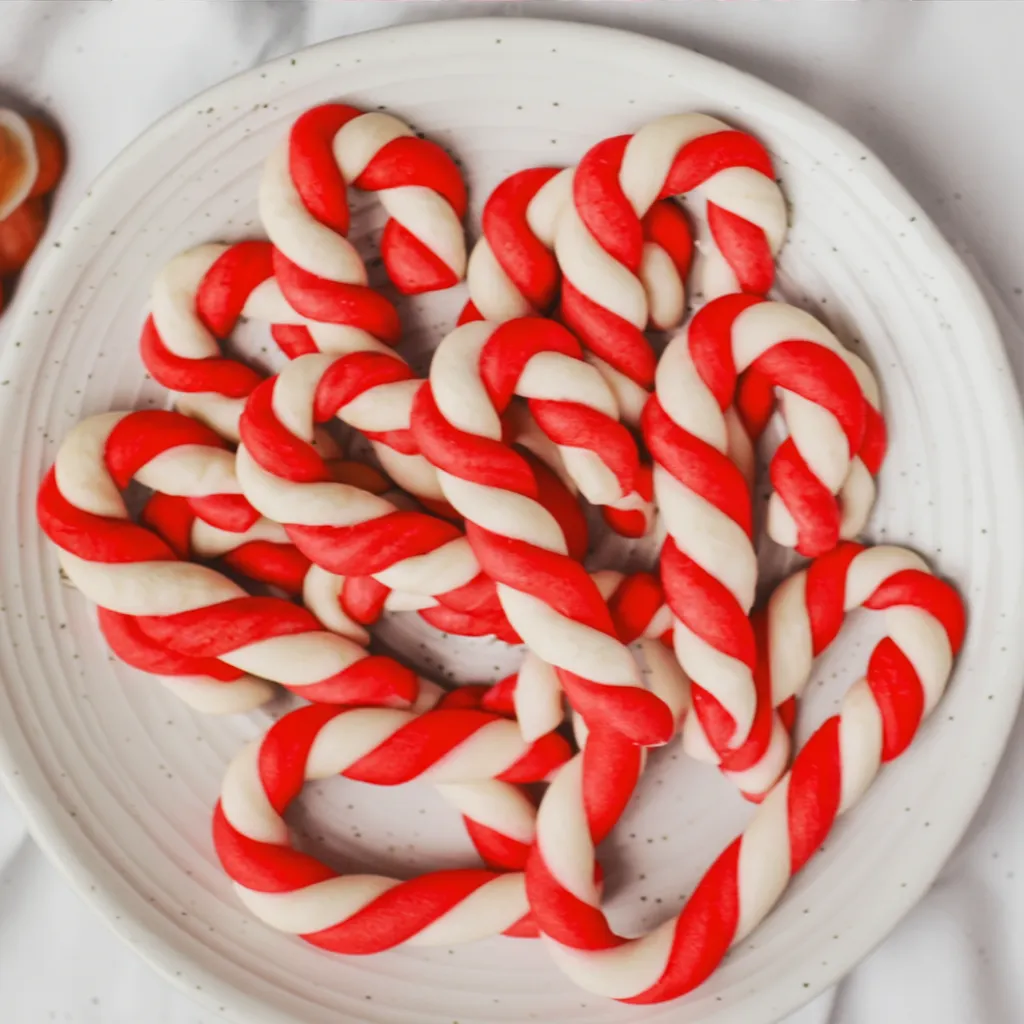 Candy Cane Cookies on festive Christmas table with lights
