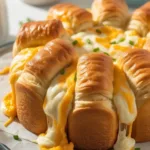 Golden-brown Chicken Crescent Rolls on a plate, ready to serve.