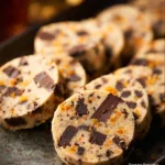 Freshly baked Chocolate Orange Shortbread cookies on a cooling rack.