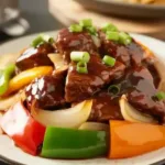Delicious crock pot pepper steak with colorful peppers and tender meat