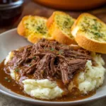 Slow Cooker Beef Manhattan served with gravy and mashed potatoes