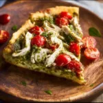 Chicken Pesto Paleo Pizza topped with fresh basil and grilled chicken