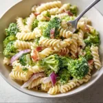 Delicious broccoli pasta salad with colorful vegetables and dressing