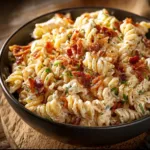 Creamy Bacon Cheddar Ranch Pasta Salad in a bowl with fresh ingredients