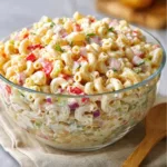 Delicious homemade macaroni salad in a bowl with colorful vegetables