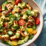 Fresh Avocado Chicken Salad served in a bowl with vegetables