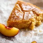 Delicious Brown Sugar Peach Cake topped with fresh peaches and caramel