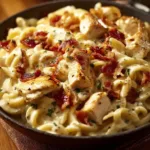 Creamy Chicken Bacon Ranch Pasta high angle view with bacon and herbs
