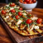 Chicken Caprese Flatbread garnished with basil and mozzarella cheese