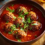 Delicious classic porcupine meatballs served with rice and sauce.