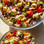 A vibrant Cowboy Caviar Pasta Salad featuring beans, corn, and fresh vegetables.