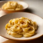 Creamy roast garlic and lemon pasta sauce served over pasta