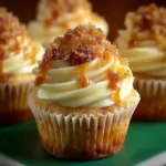 Decadent vanilla bean crème brûlée cheesecake cupcakes on a table.