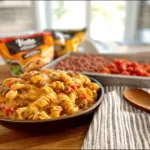 Easy Taco Macaroni & Cheese Dinner served with toppings and fresh ingredients.