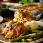 Delicious plate of Mississippi Chicken garnished with herbs and spices.