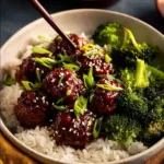 Sticky Mongolian Beef Meatballs served on a plate with garnish