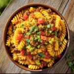 Delicious Taco Pasta Salad with colorful ingredients and toppings.