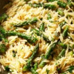 Delicious Garlic Butter Orzo with fresh Asparagus served in a bowl