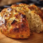 Golden-brown Garlic Herb Dutch Oven Bread fresh out of the oven