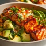 Honey glazed salmon bowl with colorful vegetables and rice