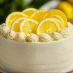 Moist lemon layer cake with vibrant lemon frosting and layers of fluffy sponge.