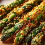 Deliciously baked Parmesan crusted asparagus on a plate