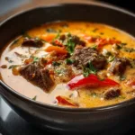 Delicious Philly Cheese Steak Soup topped with melted cheese and fresh ingredients.
