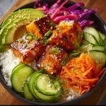 A colorful salmon bowl with fresh vegetables and grains