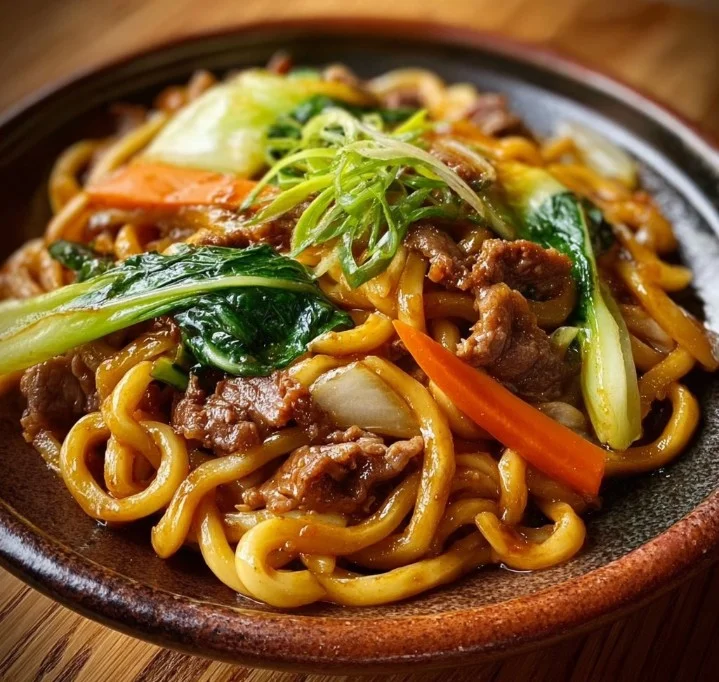 Beef Stir-Fried Udon Noodles 4 Beef stir-fried udon noodles with vegetables in a bowl