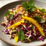 Crispy Spicy Thai Mango Slaw with fresh ingredients and vibrant colors