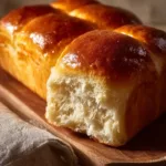 Freshly baked Japanese milk bread with a soft texture and golden crust