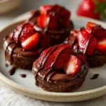 Delicious strawberry chocolate bites featuring fresh strawberries dipped in rich chocolate.